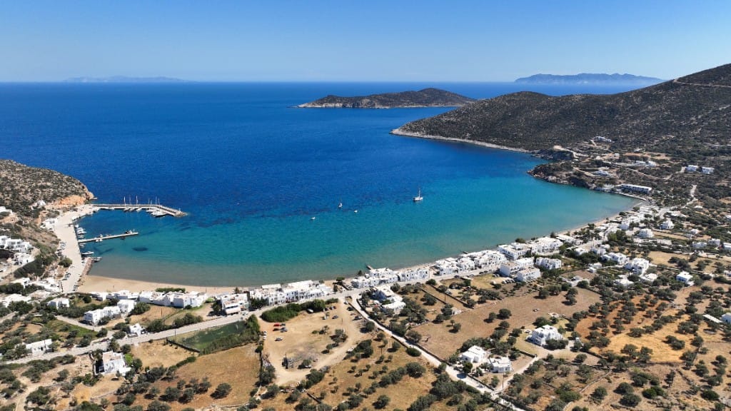 Aerial view of Platis Gialos bay on Sifnos with long sandy beach and turquoise water