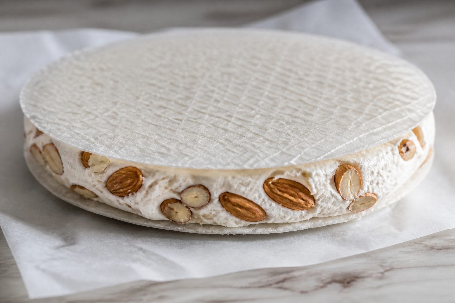 Halvadopita nougat wafers with whole almonds between thin ostia